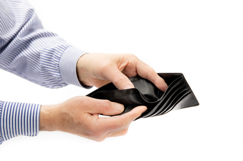 person looking in an empty wallet