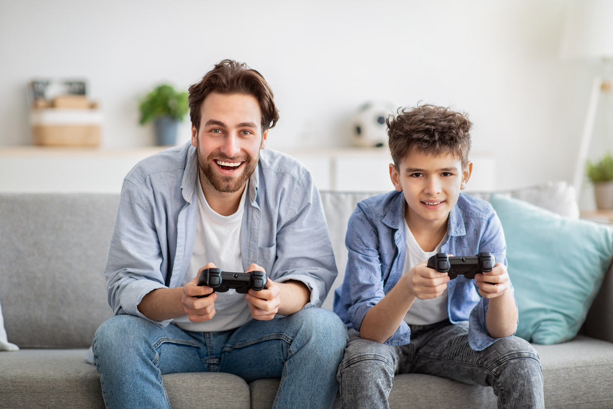 Father and son playing video games