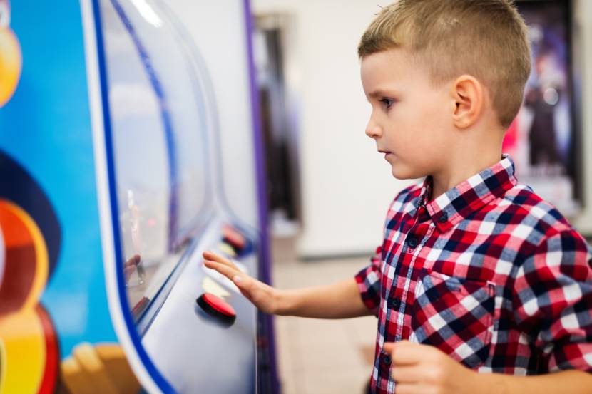 little boy playing a video game