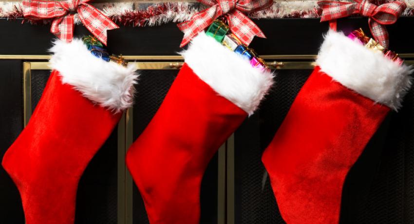Christmas stockings hung by a fireplace