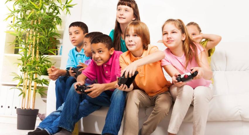 Group of children playing video games