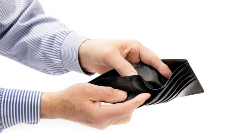 person looking in an empty wallet